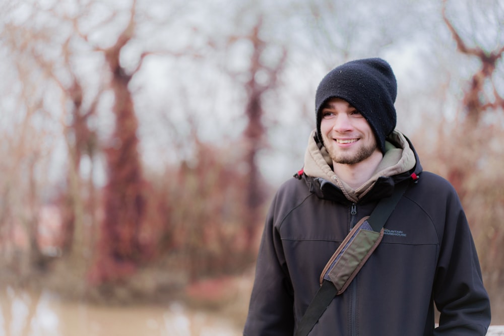 man in black knit cap and black jacket