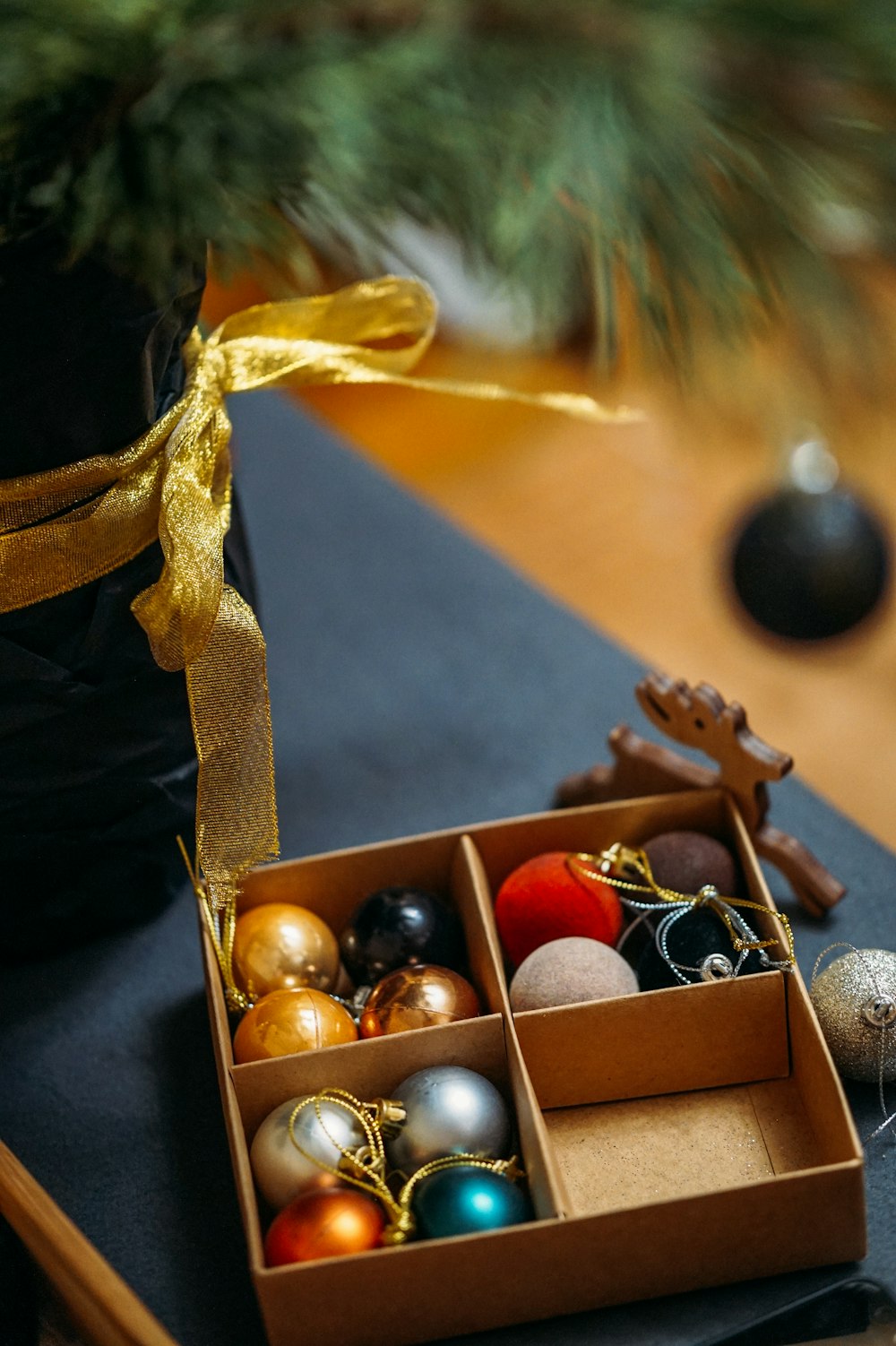 red and gold baubles on brown box