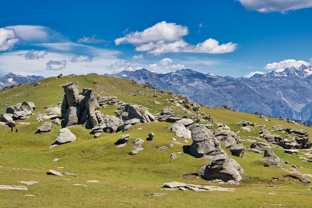 gray rocky mountain under blue sky during daytime