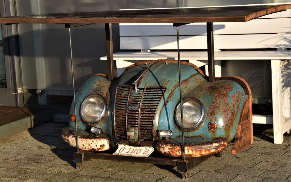 blue car parked in garage