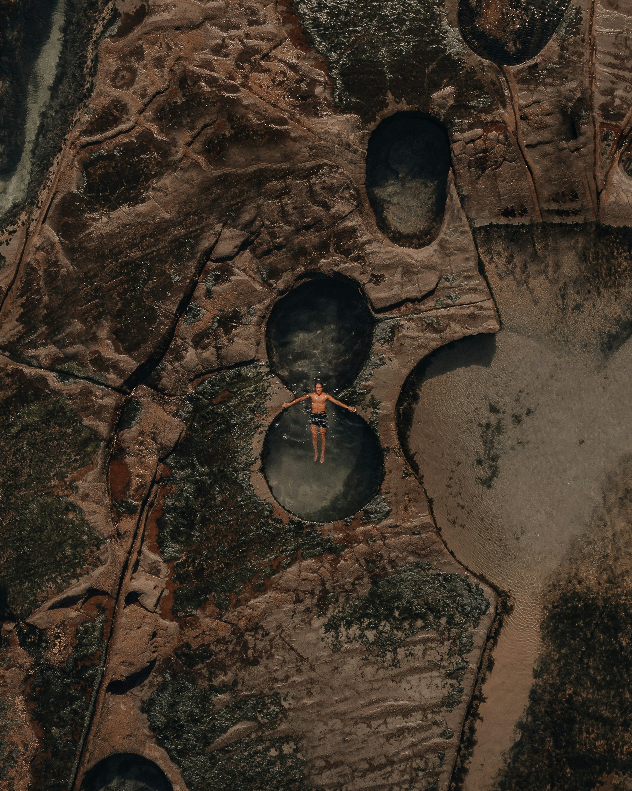 black and brown round mirror