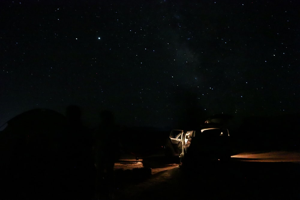 cars parked on parking lot during night time