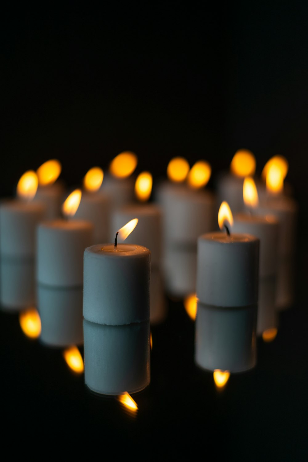white pillar candles with fire