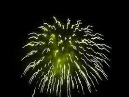 Neon green comets streaking through smoky darkness with glowing sparks trailing off