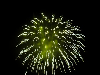 Eco-friendly green crackers emitting soft, colorful sparks with minimal smoke