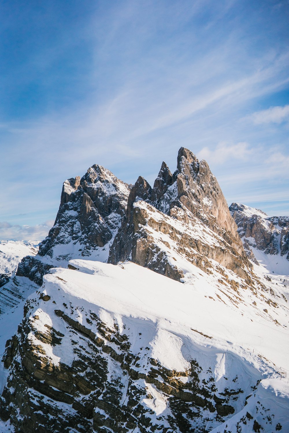 snow covered mountain under blue sky during daytime