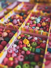 red green and yellow beads on white box