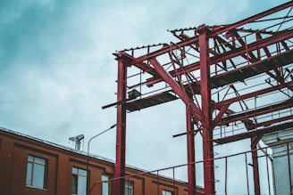 red metal ladder near building