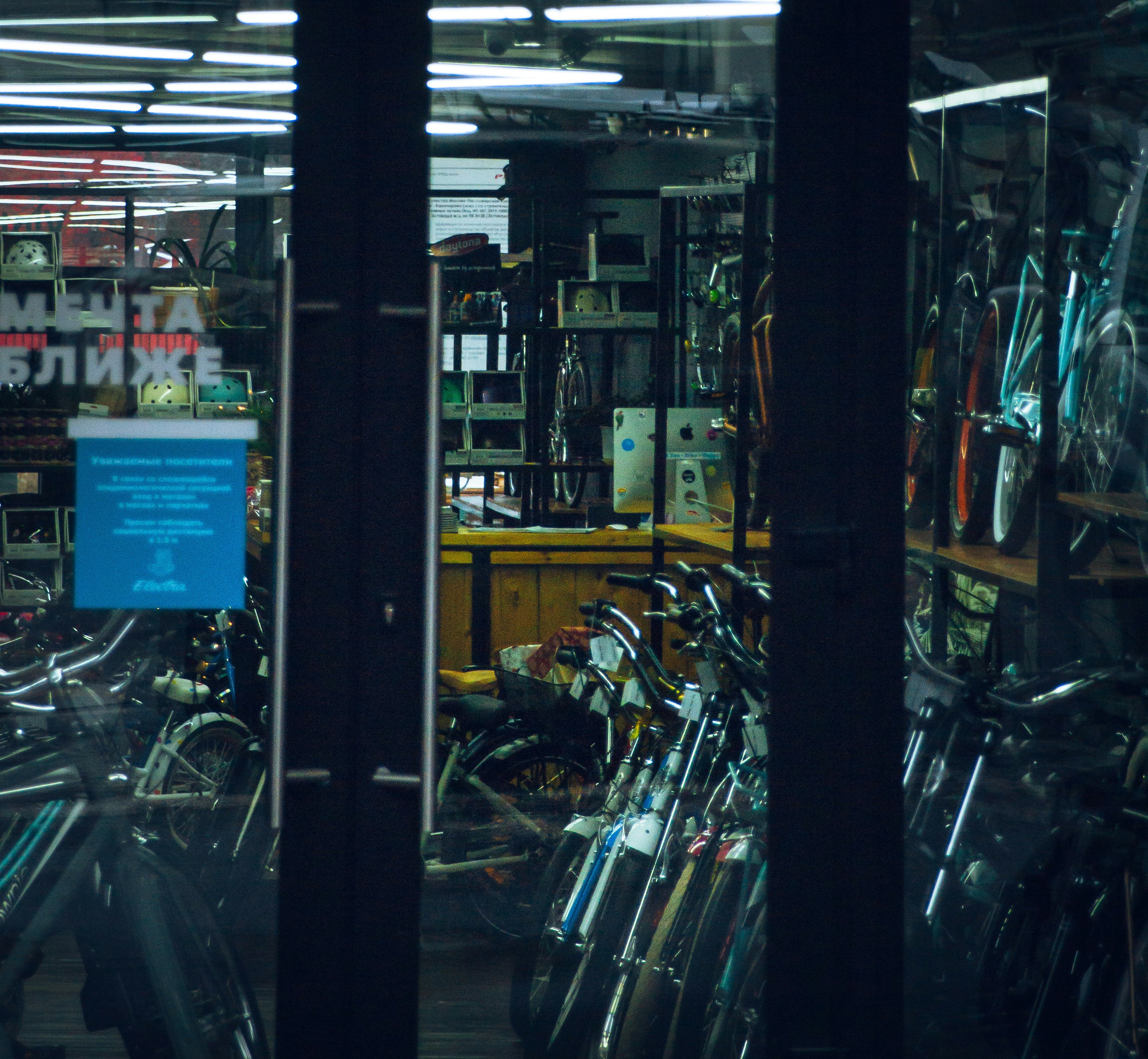 black and yellow motorcycle parked beside store