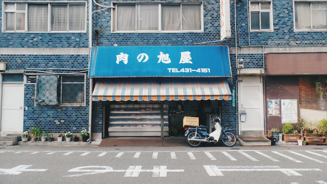 black motorcycle parked beside store,