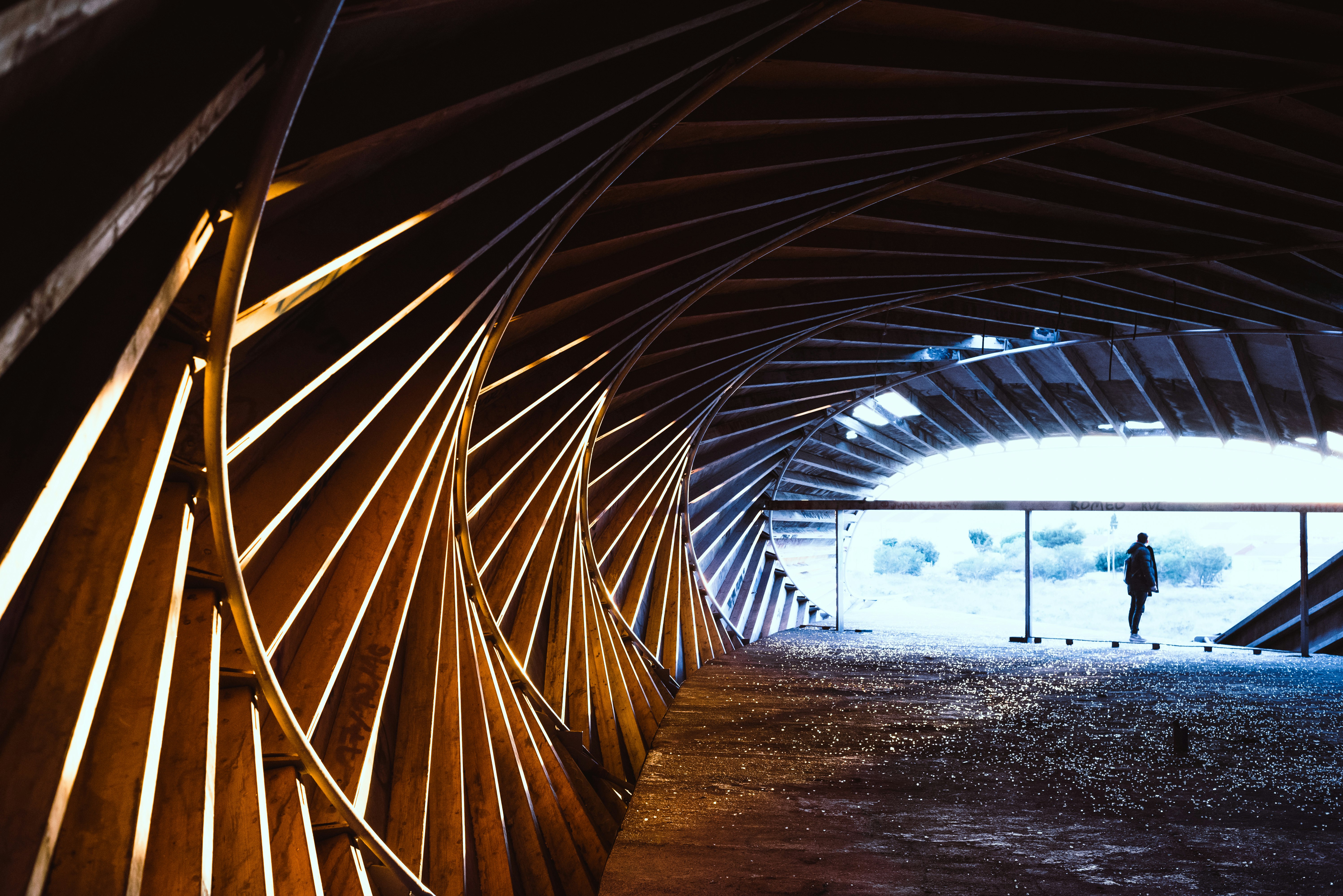 brown wooden tunnel during daytime