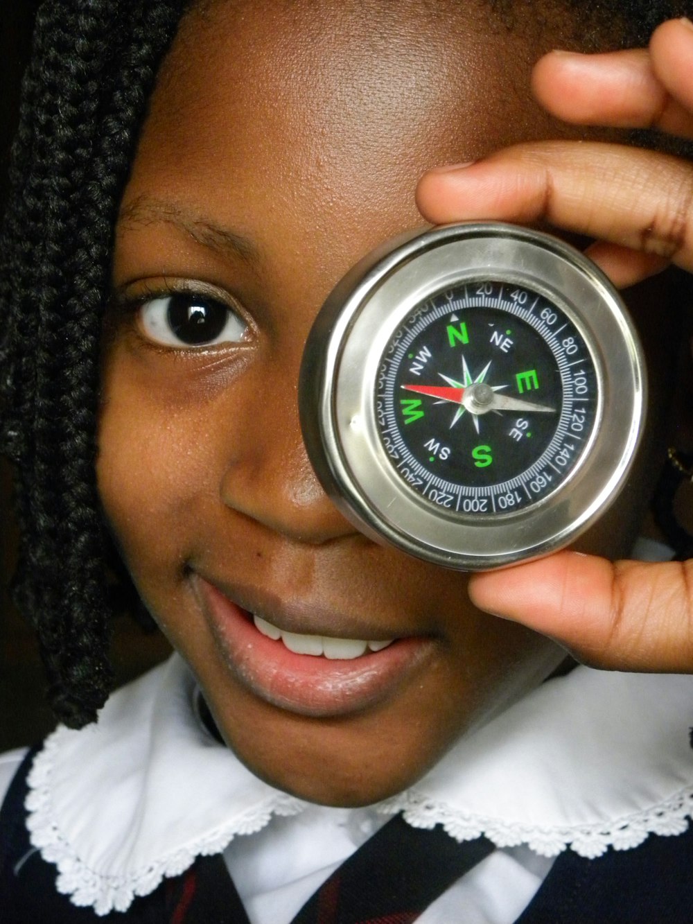 person wearing silver round analog watch