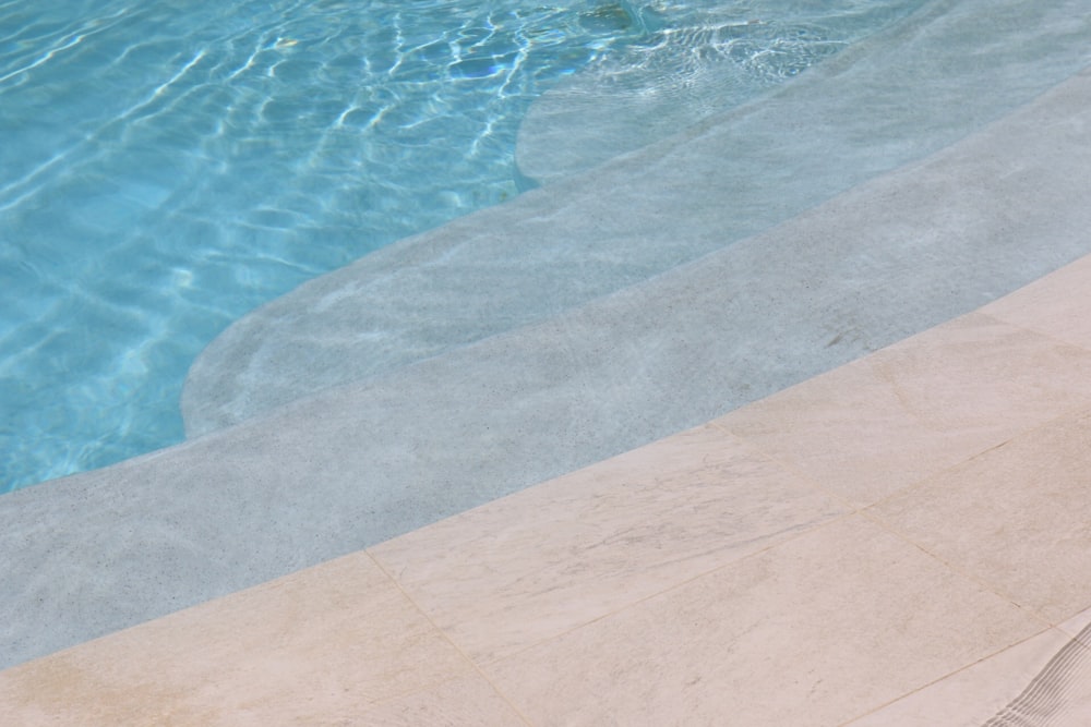 brown concrete floor near swimming pool