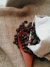 white textile on brown wooden table