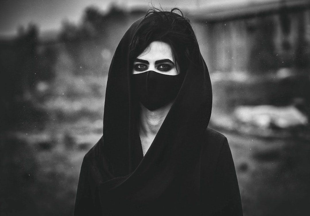 grayscale photo of woman in hijab