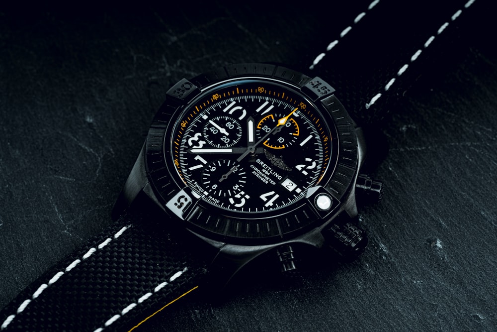 black and silver round chronograph watch