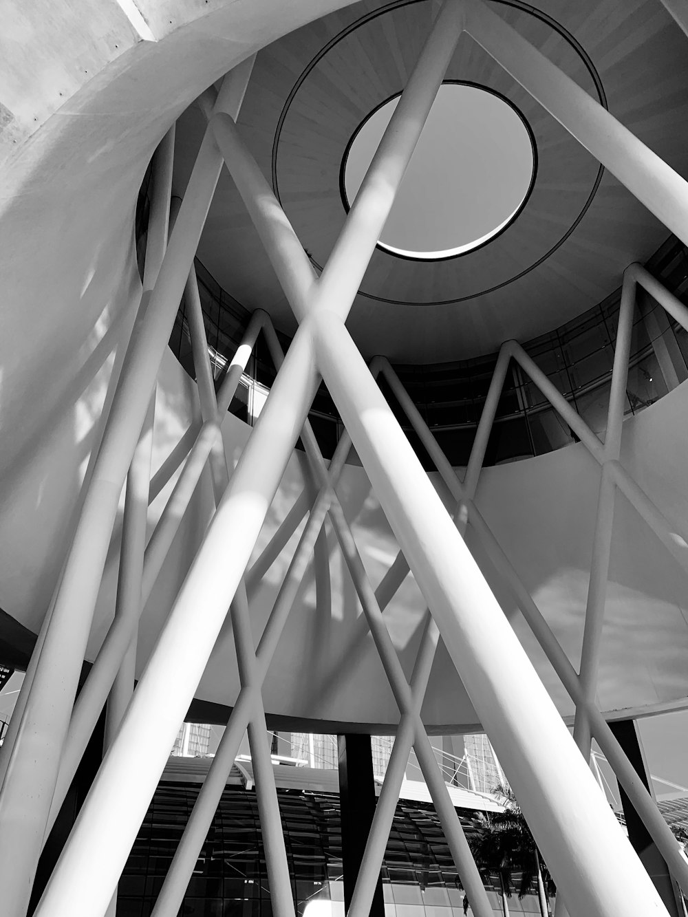 white metal spiral staircase in grayscale photography