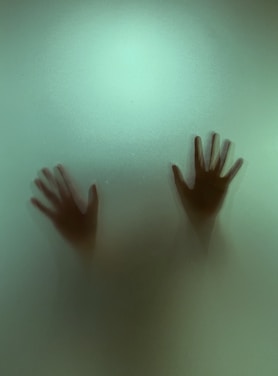 persons hand on water