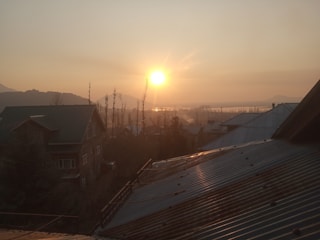 Sunset view of a peaceful residential neighborhood with empty plots.
