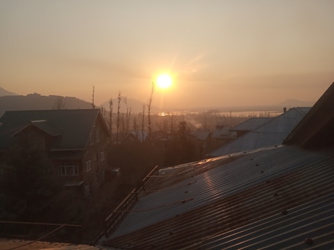 Sunset view of a peaceful residential neighborhood with empty plots.