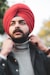 man in red knit cap and black jacket