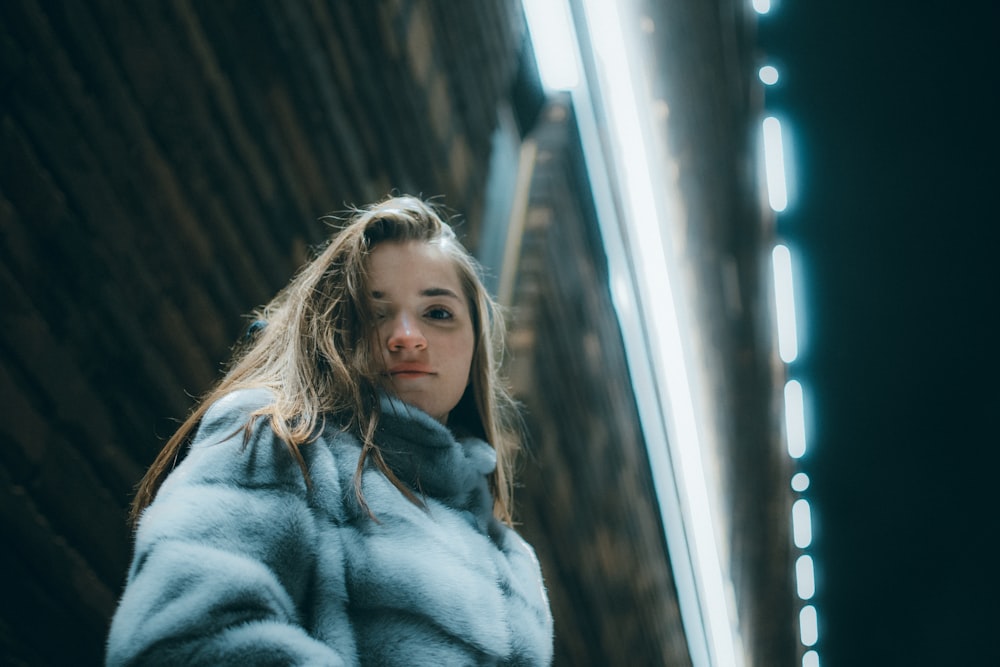 woman in gray fur coat