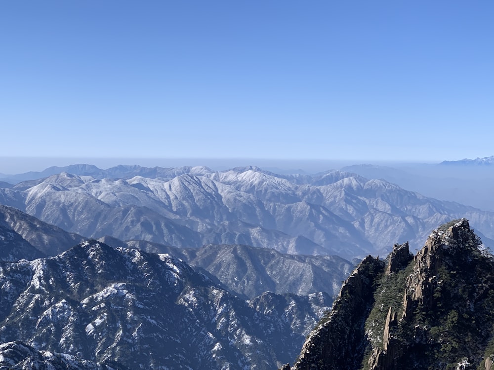 green and brown mountains under blue sky during daytime