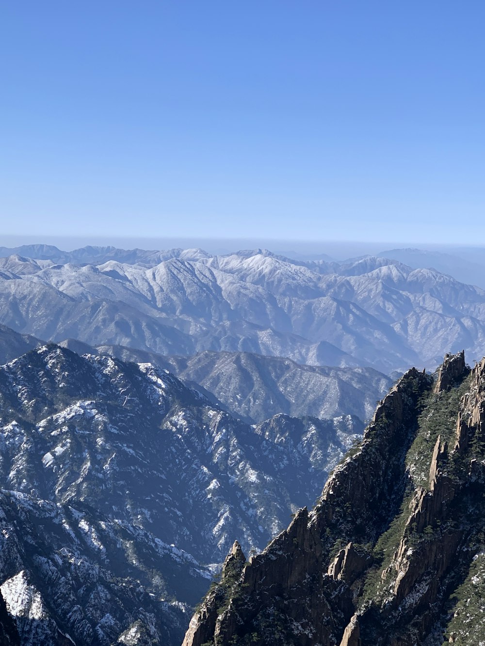 black and white mountains under blue sky during daytime