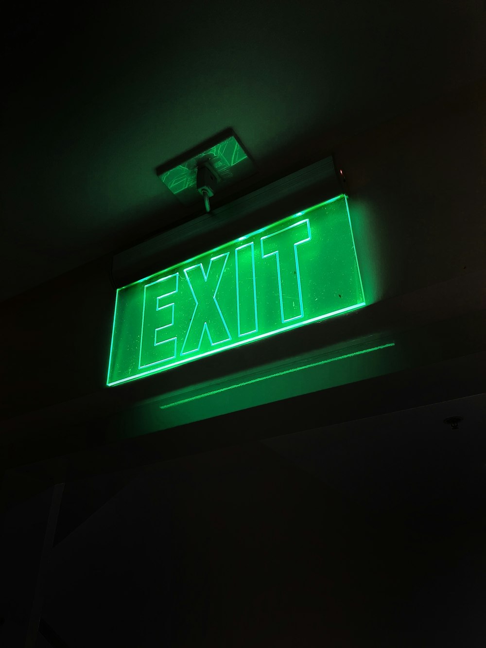 green and white exit sign