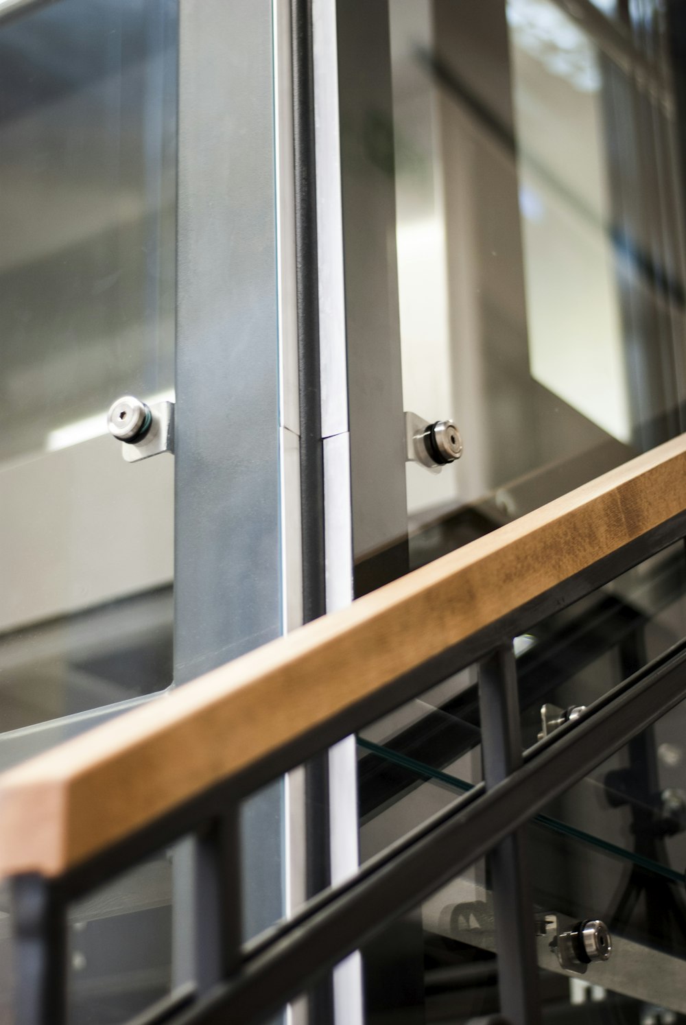 stainless steel door lever on white wooden door