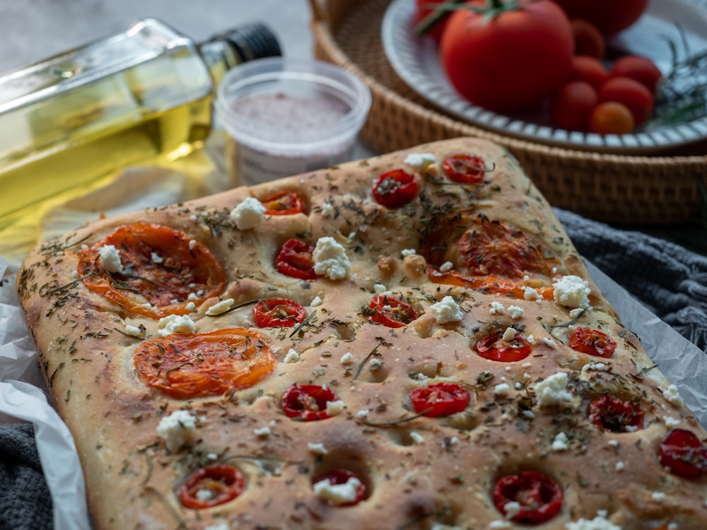 white and brown pizza on brown wooden table