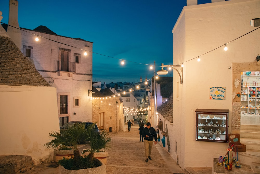 people walking on street during night time