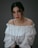 woman in white off shoulder dress