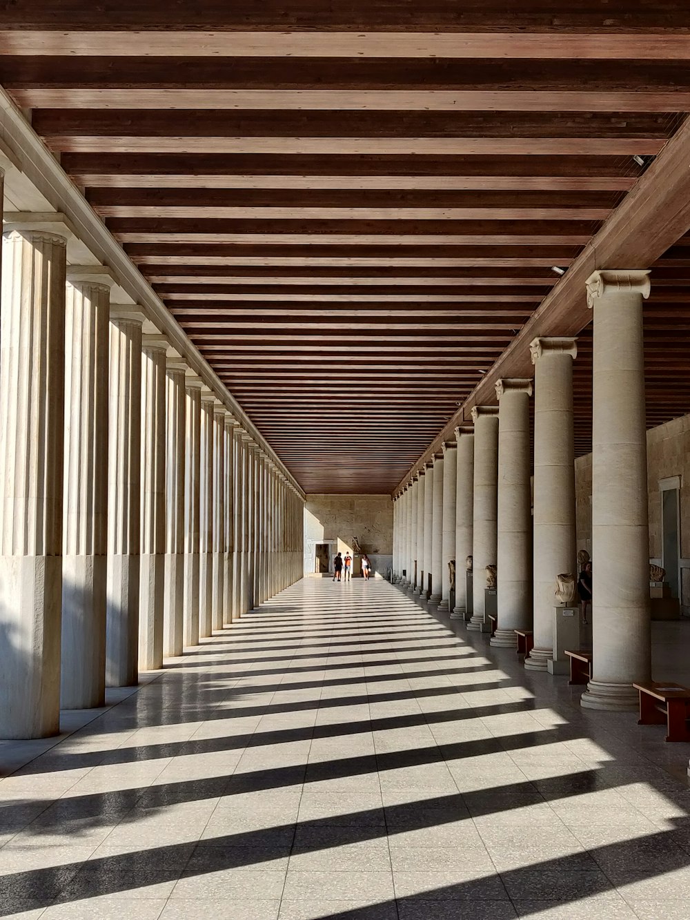 white and brown hallway with no people