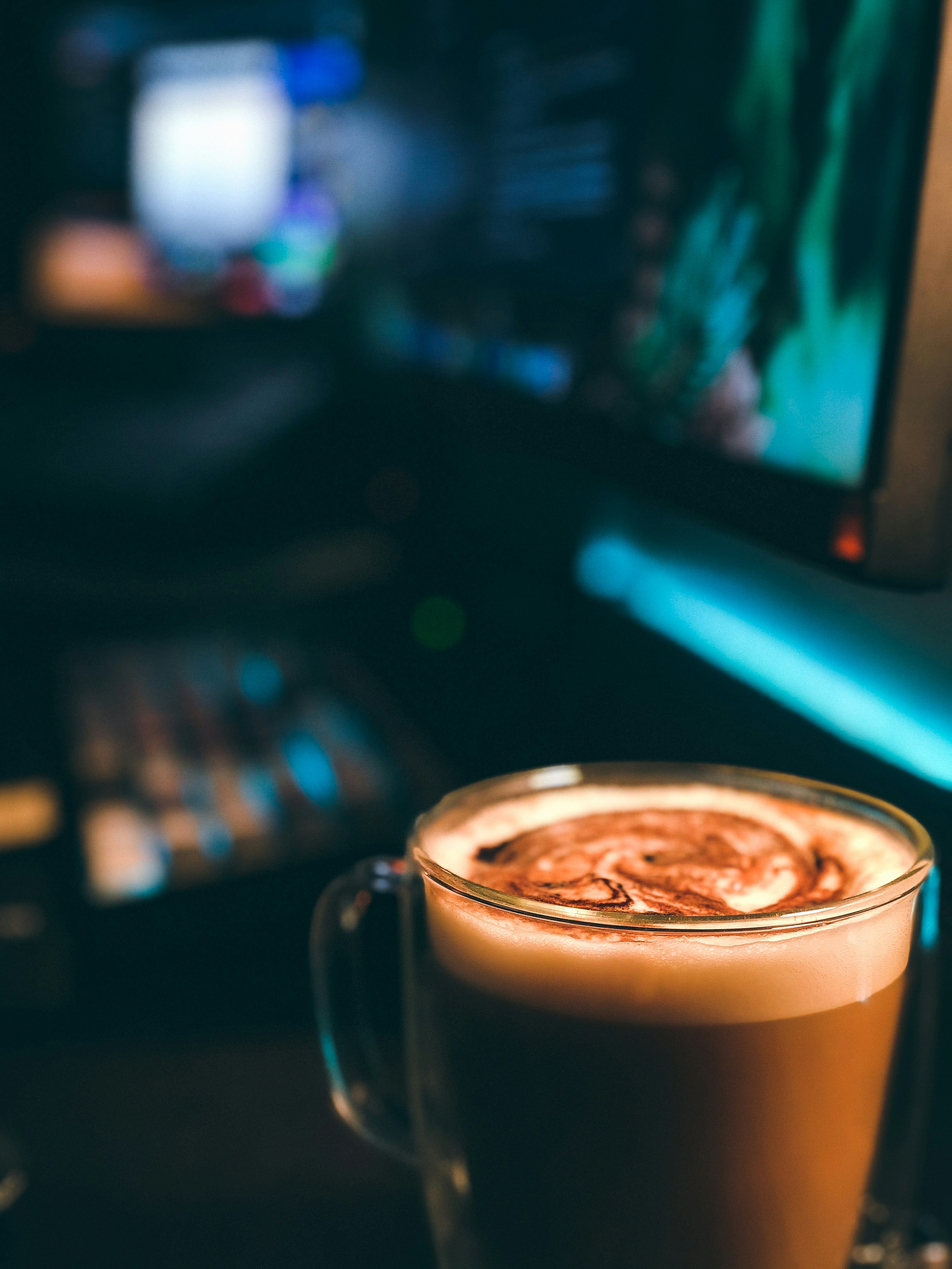 clear glass mug with brown liquid
