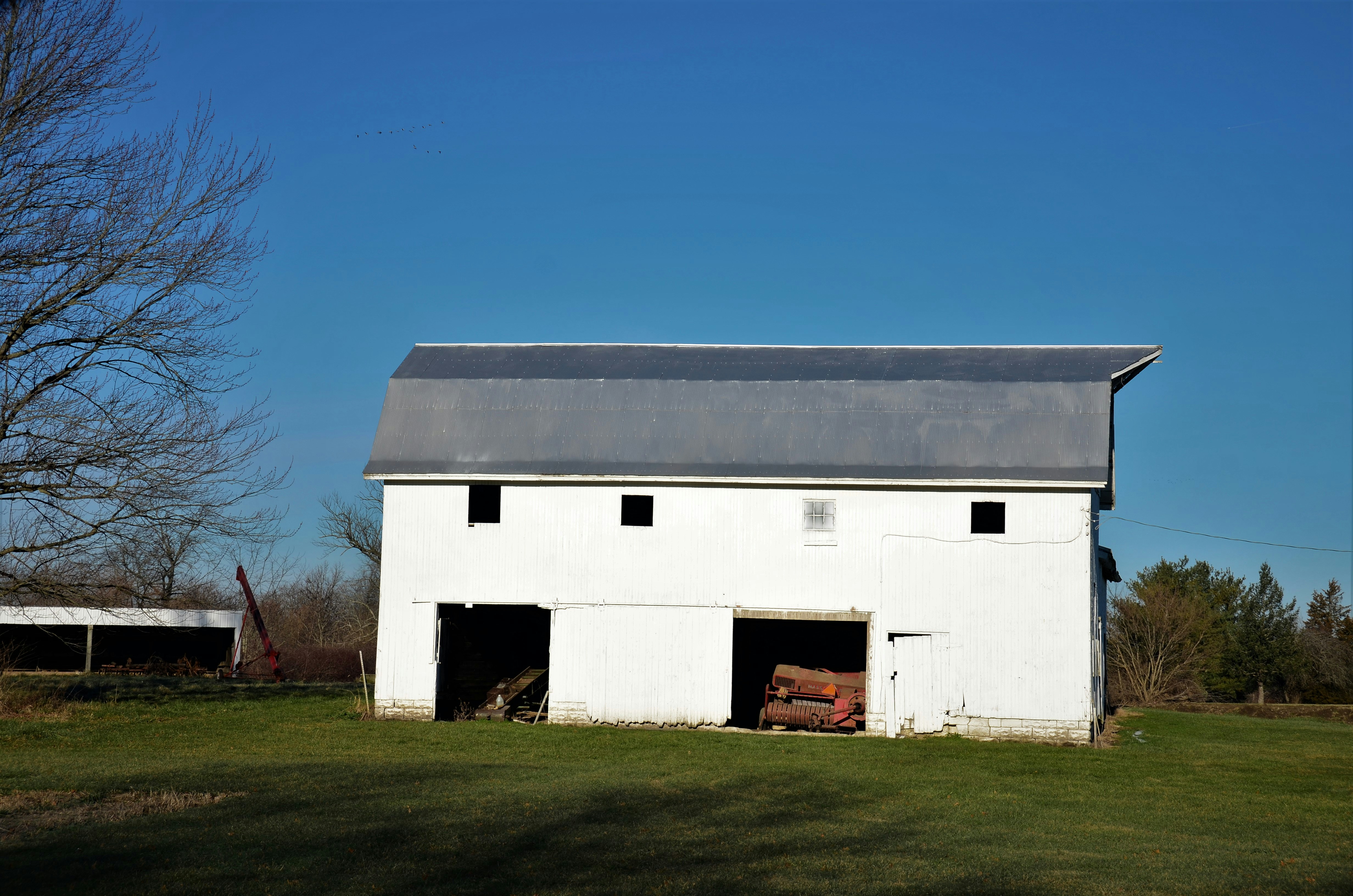 farmhouse with contrasting black window frames - exterior farmhouse remodel
