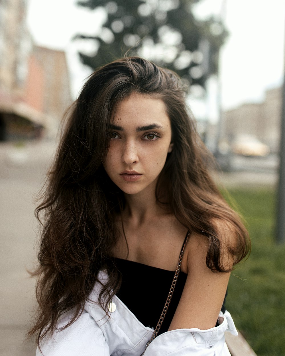 woman in white and black sleeveless top