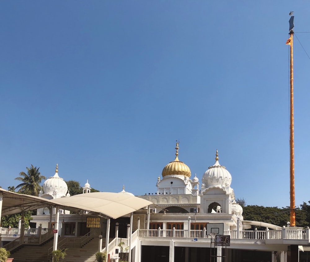 white and gold dome building under blue sky during daytime