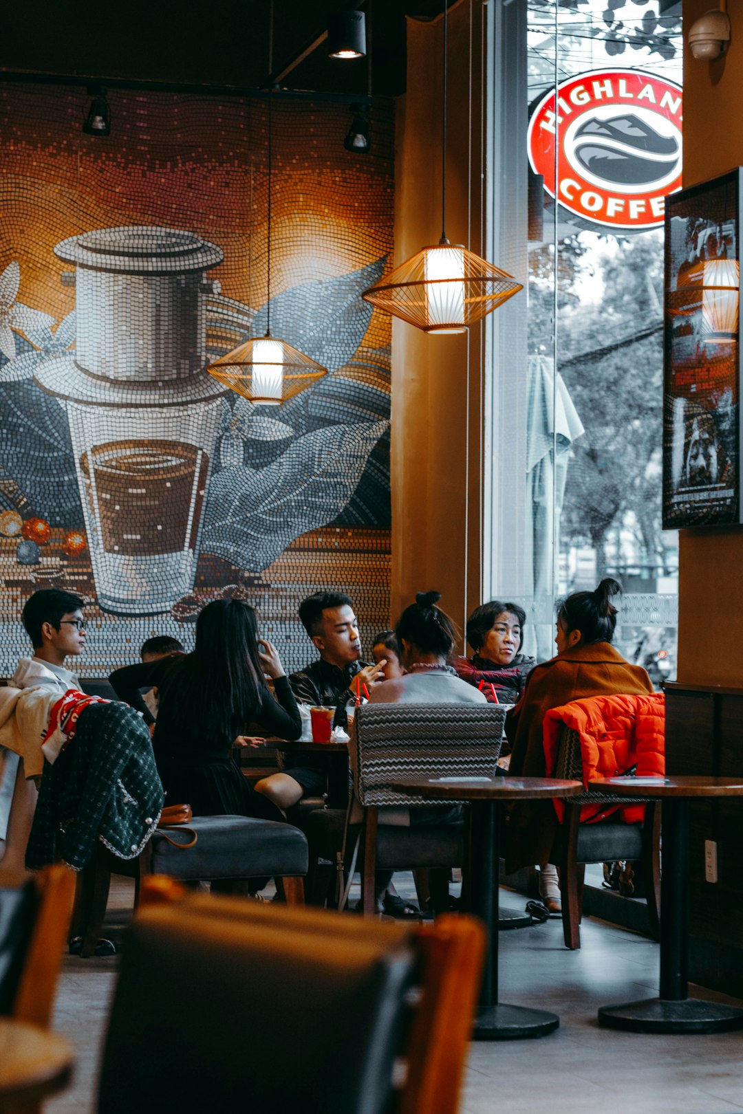 people sitting on chair near table