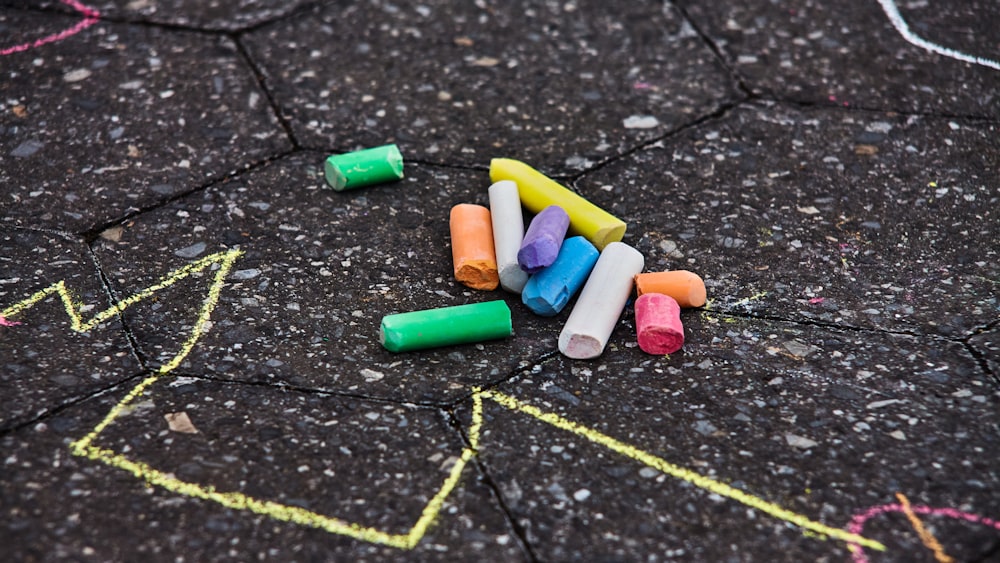 green blue and pink medication pill on black surface