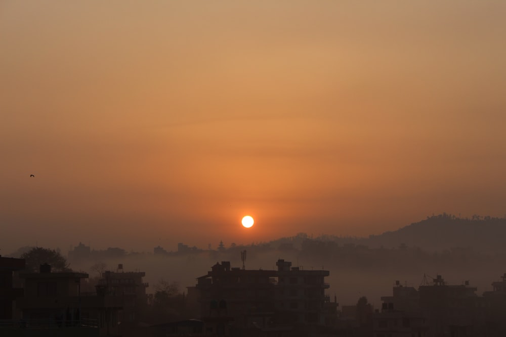 silhouette of buildings during sunset