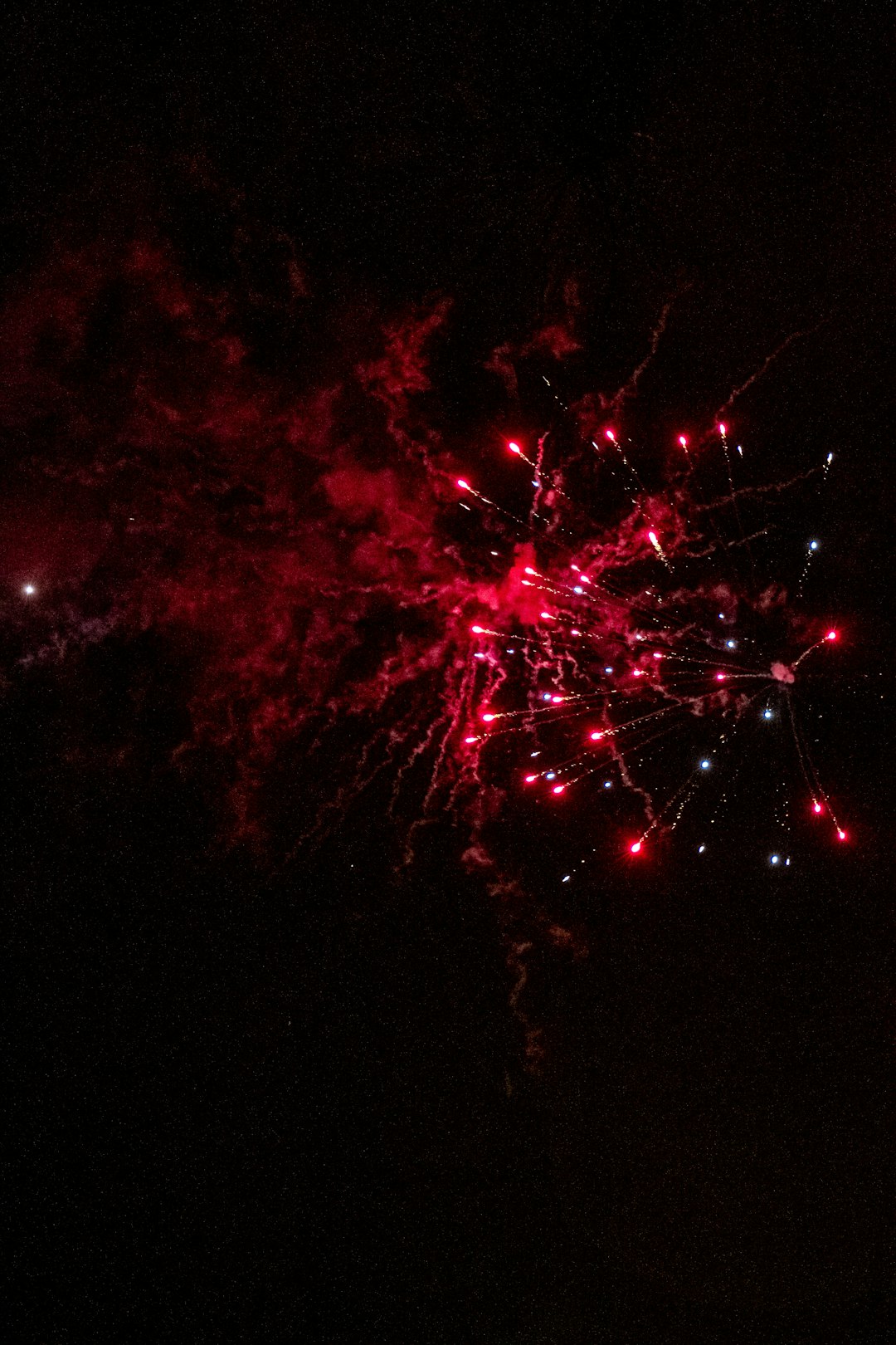 red fireworks in the sky during night time