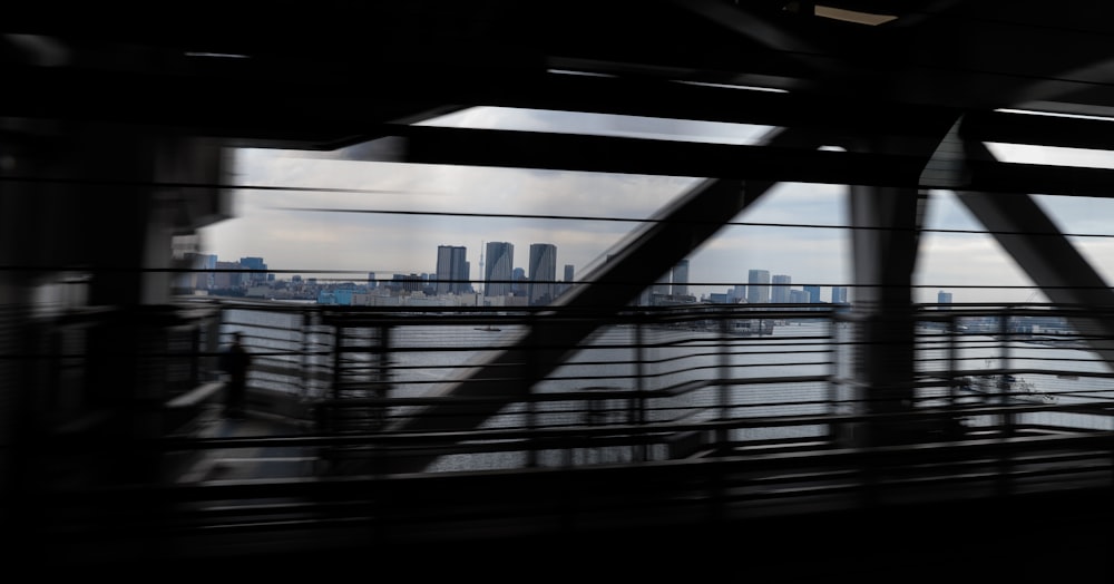 silhouette of a person walking on a bridge