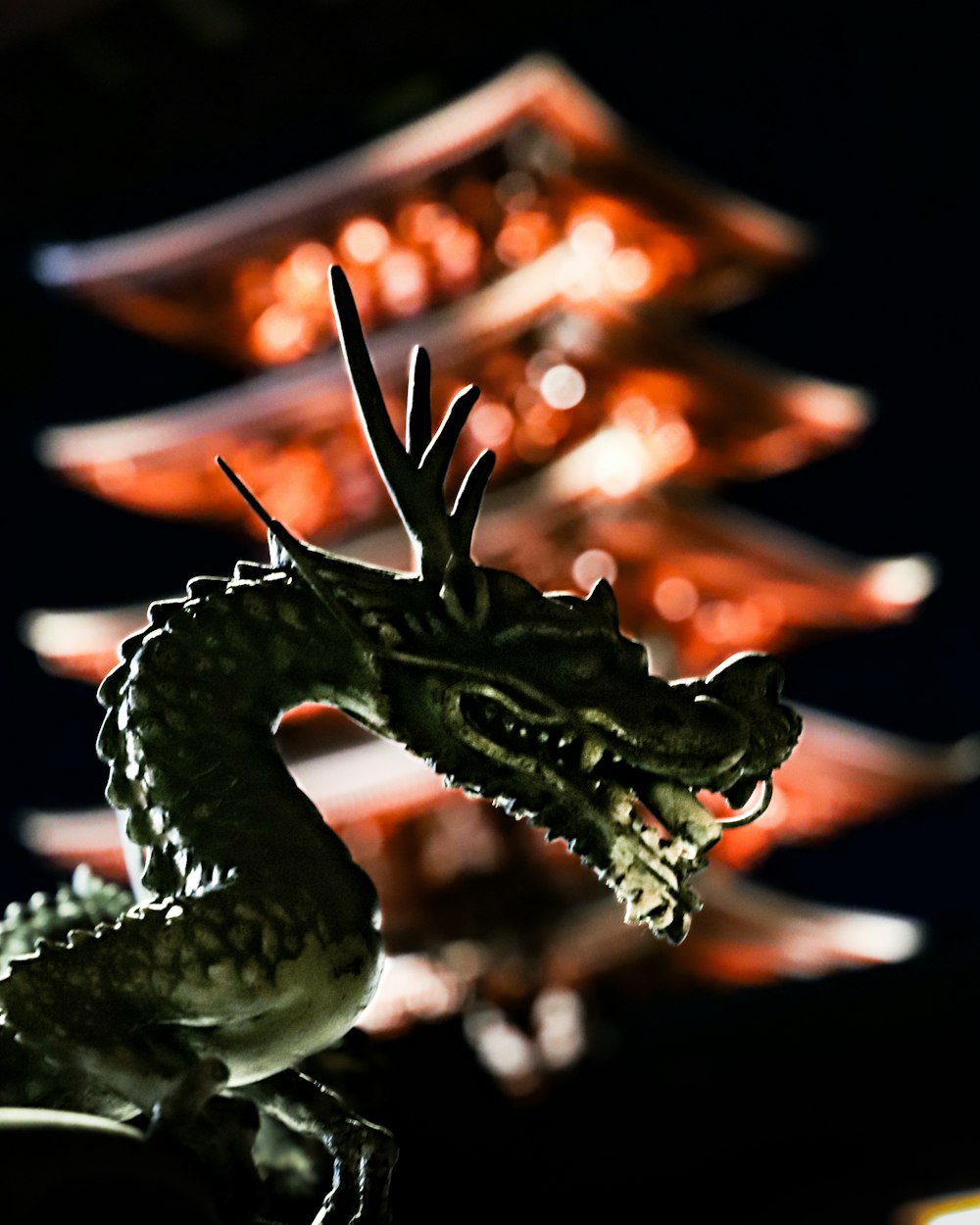 brown dragon figurine in close up photography
