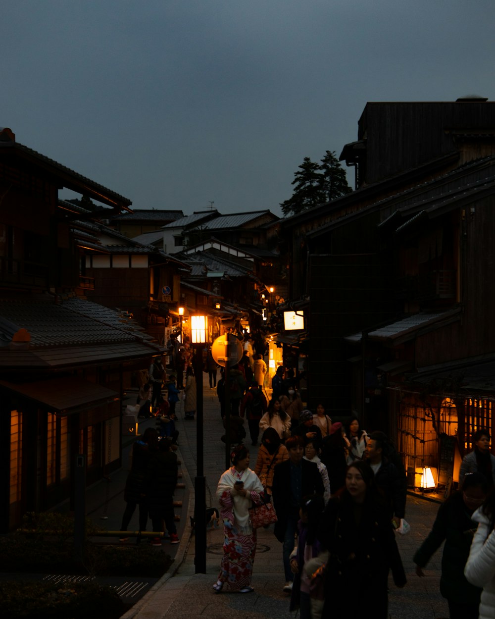 people walking on street during night time