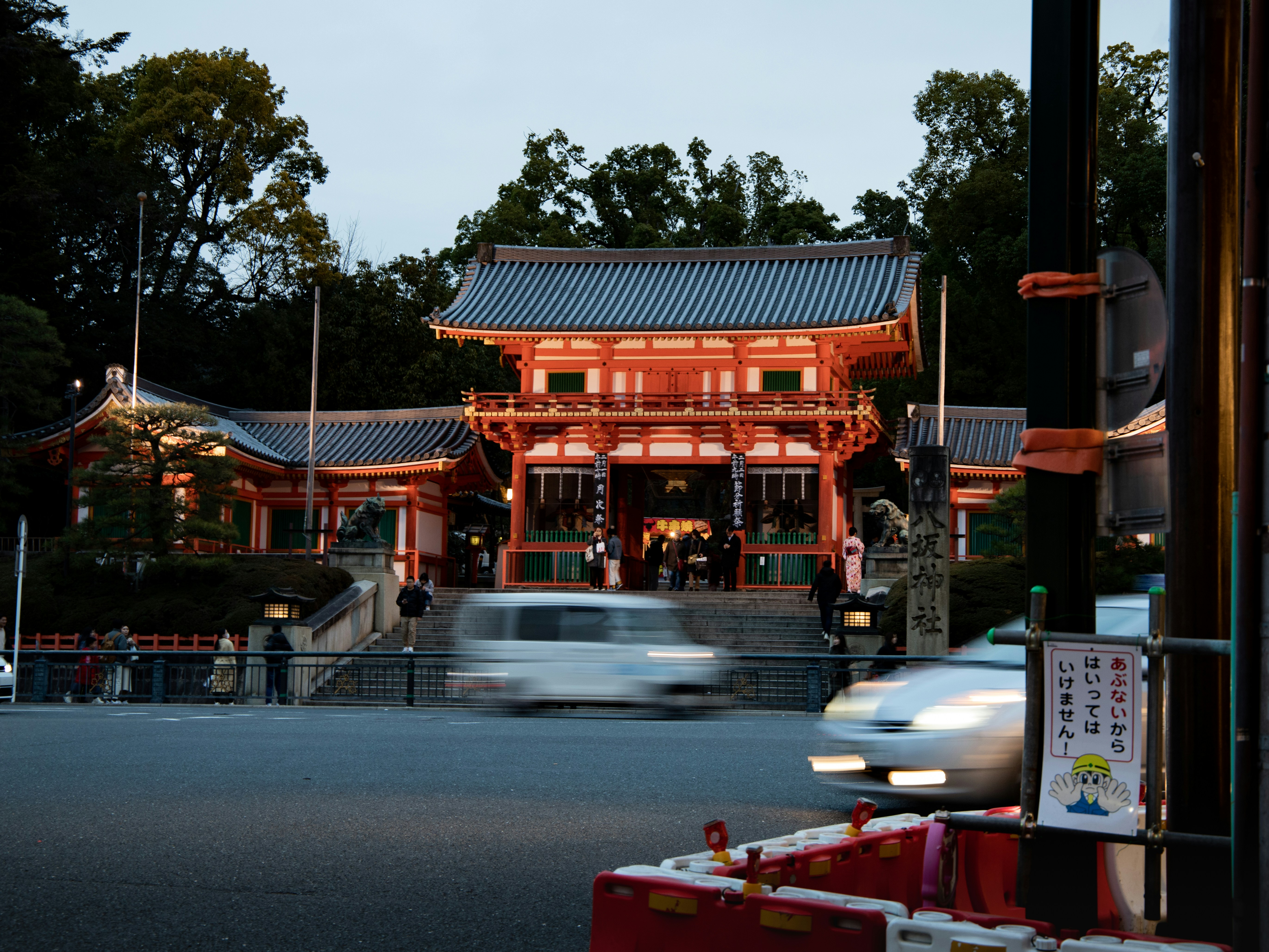 white car parked near brown and white building during daytime