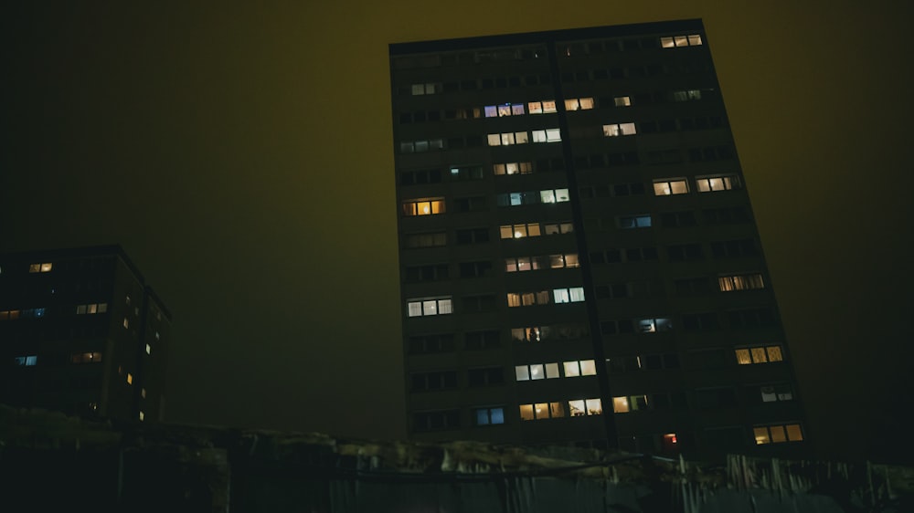 black and white concrete building during night time