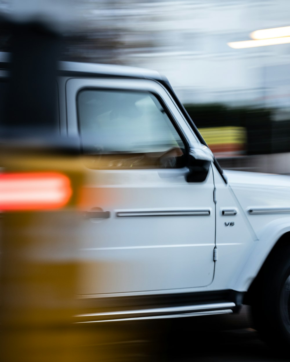 white car on the road during daytime