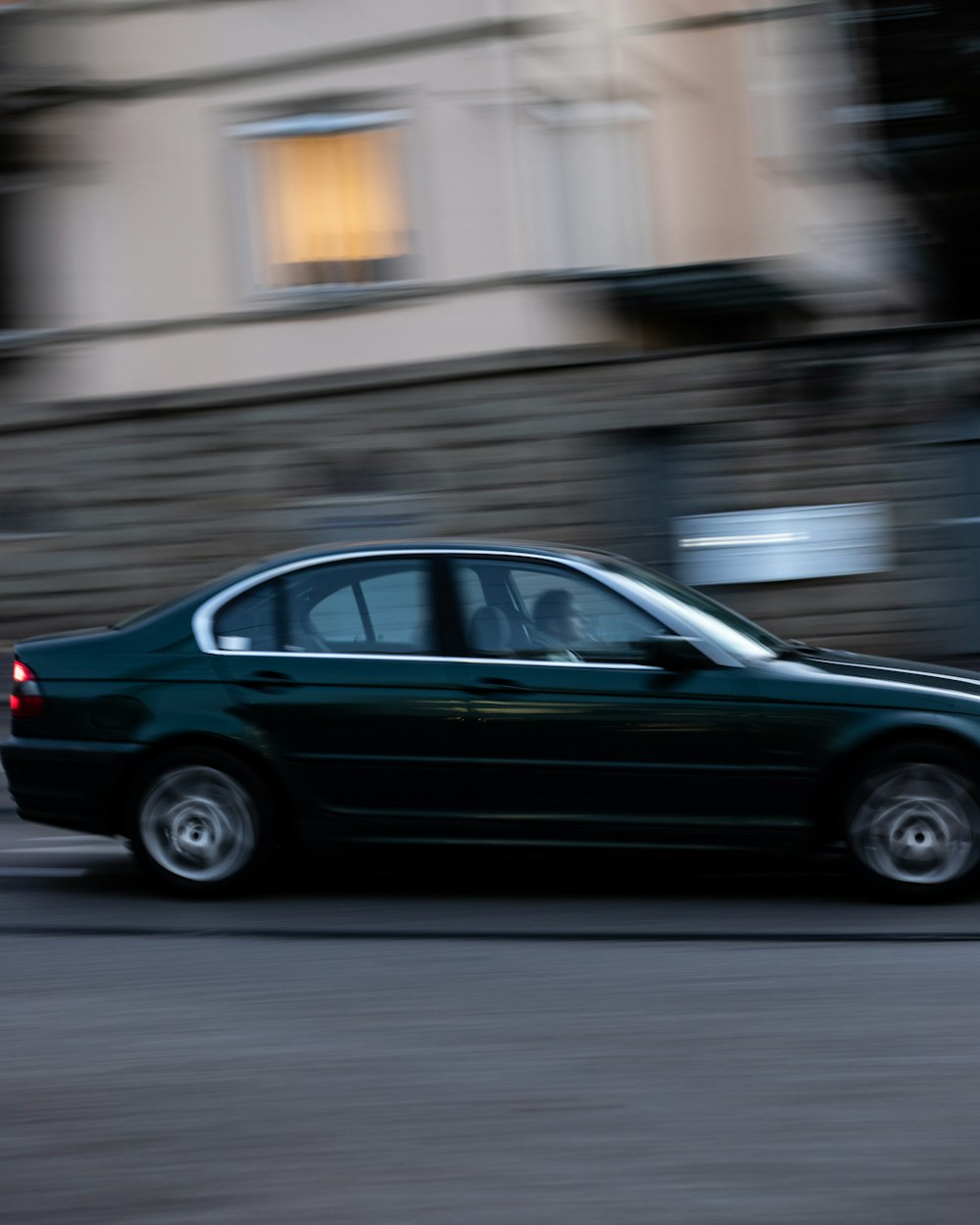 black sedan on road during daytime