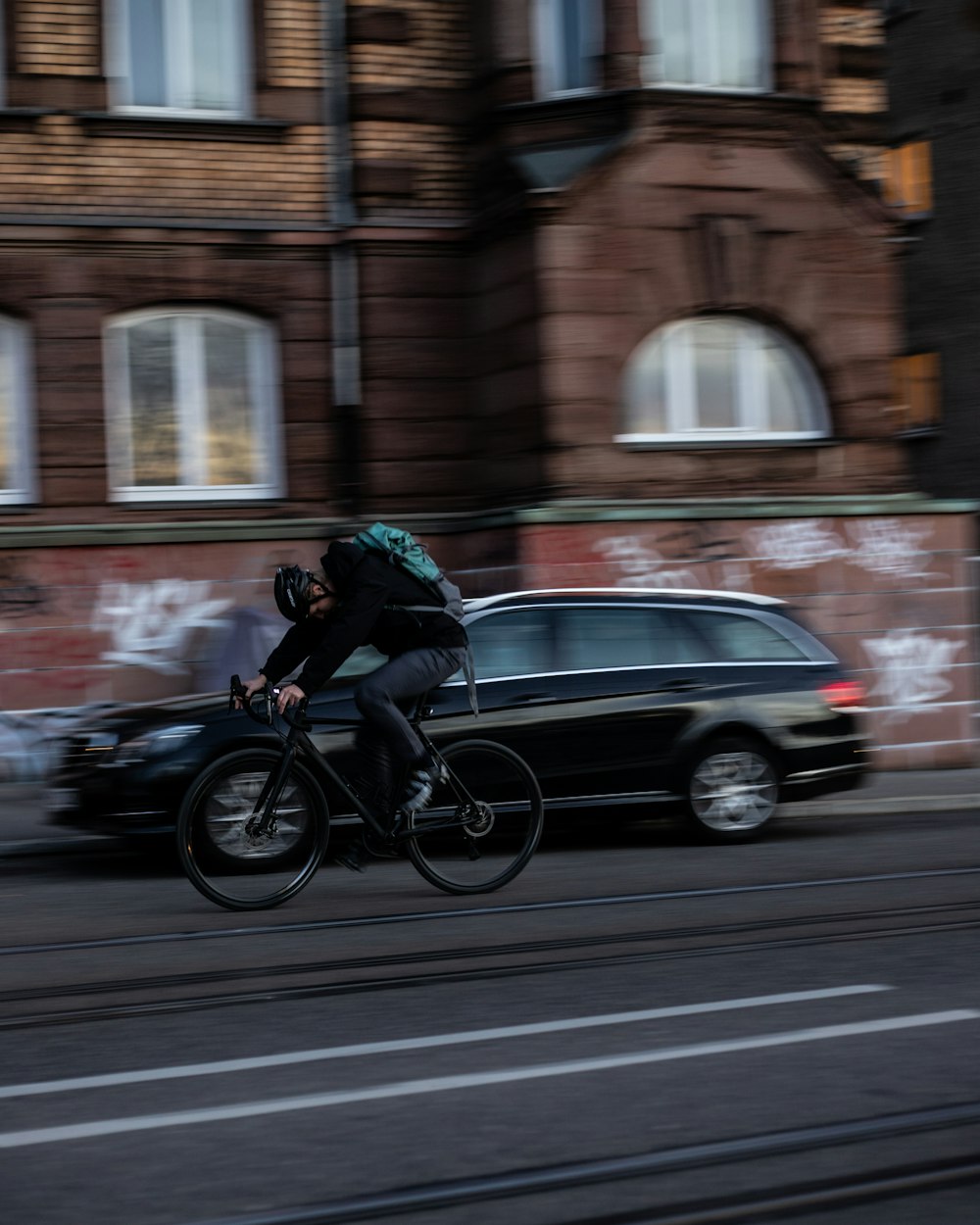 man in black jacket riding on motorcycle during daytime